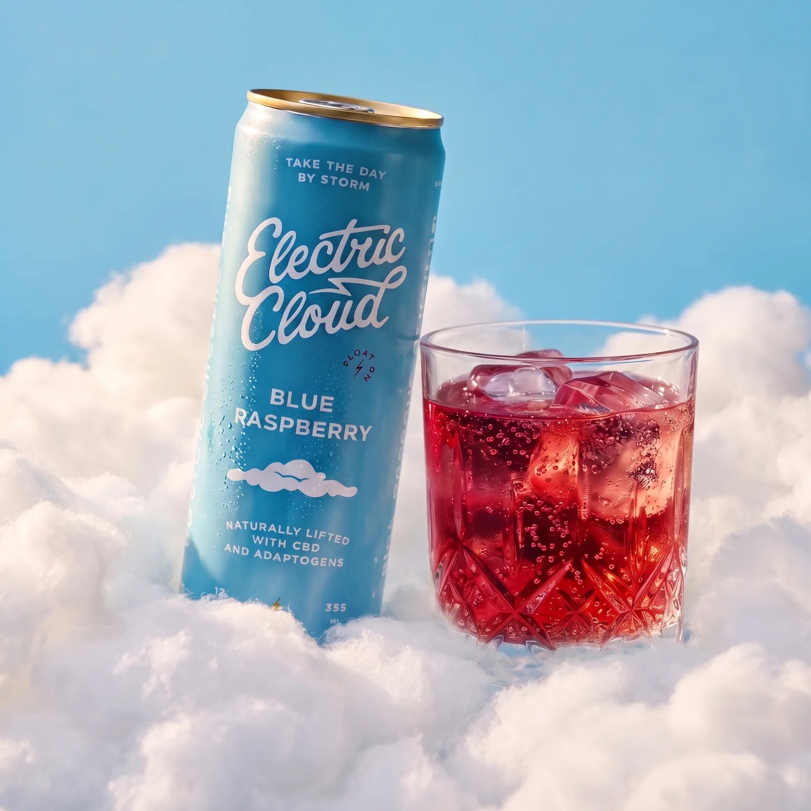 A chilled Blue Raspberry Electric Cloud beside a sparkling drink over ice