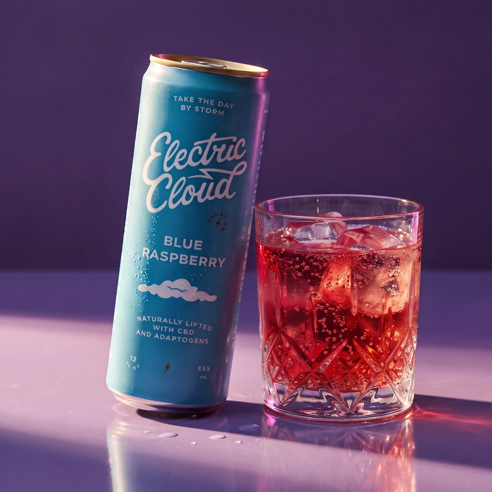 A chilled Blue Raspberry Electric Cloud beside a sparkling drink over ice